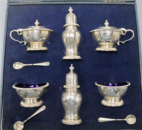 A cased 1950s/1960s six piece silver condiment set with three (ex 4) spoons, William Comyns & Sons Ltd.